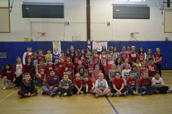 East Quogue Elementary School students and staff raised money for the annual "Hoops For Heart" basketball tournament on Friday. ALEXA GORMAN