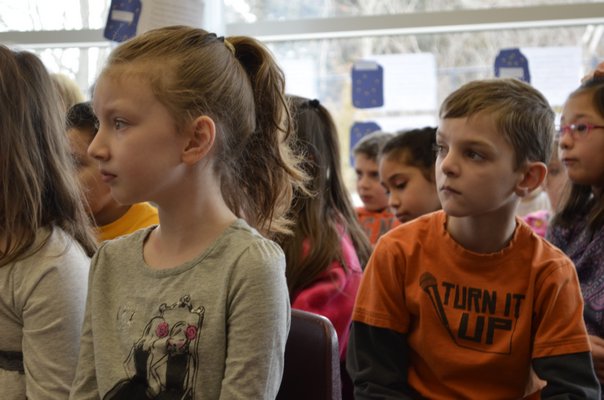 Second-graders Emma Gallagher and Garrett Bollinger listen to children's author and illustrator Patricia Polacco at Tuttle Avenue School on Friday. ALEXA GORMAN