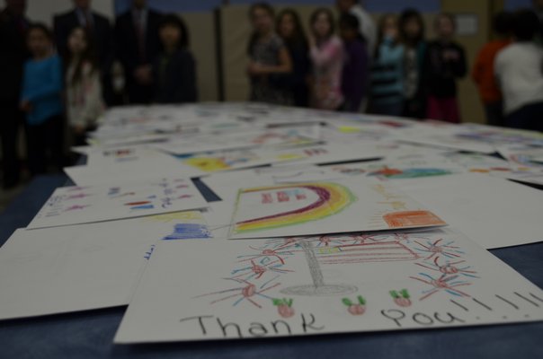 Third grade students at Remsenburg-Speonk Elementary School put together care packages to send to troops overseas on Tuesday afternoon. ALEXA GORMAN
