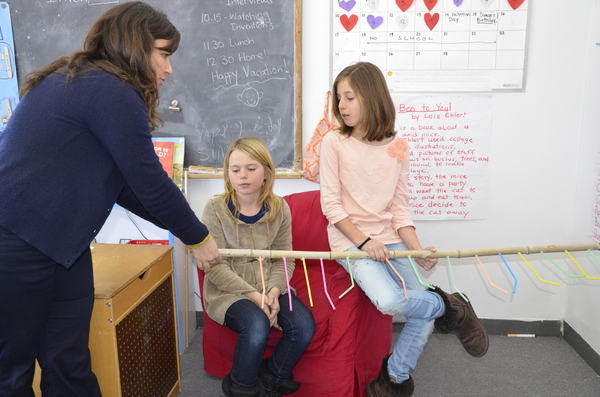 Hayground School Teacher Julie Fanelli-Denny, Naya Davidson and Isabelle Topliff explain how their indoor plant watering system works. SHAYE WEAVER