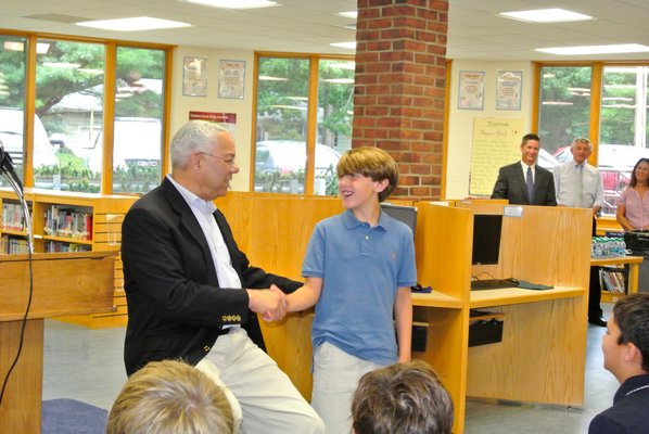 Former Secretary of State General Colin Powell fields questions from Tuckahoe School student  Robert Sior on Tuesday morning. DANA SHAW