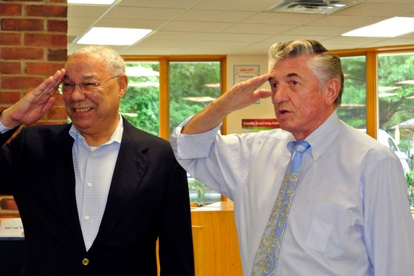 General Colin Powell and Robert Grisnik return salute to Tuckahoe students on Tuesday morning. DANA SHAW