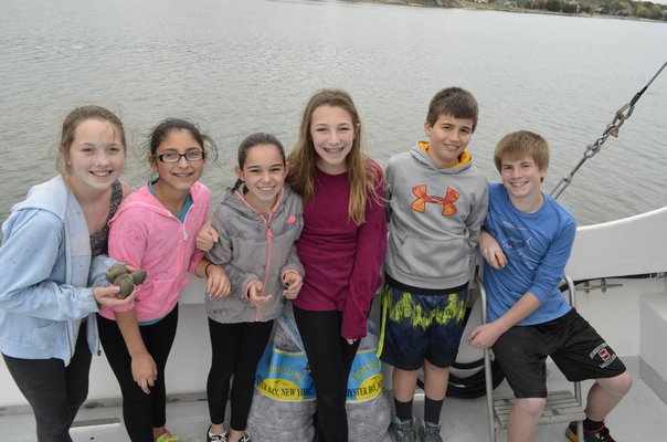 From left, East Quogue Elementary School sixth-graders Gabby Johnson, Kayla Jiminez, Sydney Heaney, Hailey Hanyo, Eric Arnoux and Michael Armitrano. ALEXA GORMAN