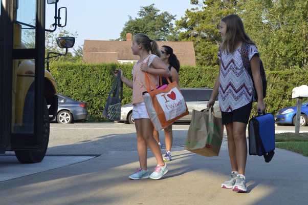 Students arrive at the Tuckahoe School Tuesday morning for the first day of the 2015-16 academic year. ALYSSA MELILLO