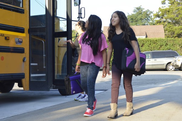 Students arrive at the Tuckahoe School Tuesday morning for the first day of the 2015-16 academic year. ALYSSA MELILLO