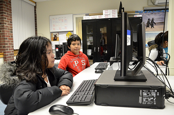 Consuelo López starting her Monday night lesson at the Digital Age Family Literacy class at Tuckahoe School. SHAYE WEAVER