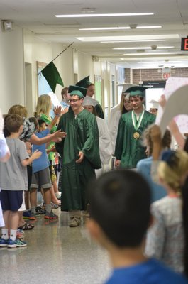 Graduating Westhampton Beach High School seniors did one last loop around their former elementary school on Wednesday. BY ERIN MCKINLEY