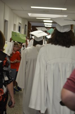 Graduating Westhampton Beach High School seniors did one last loop around their former elementary school on Wednesday. BY ERIN MCKINLEY