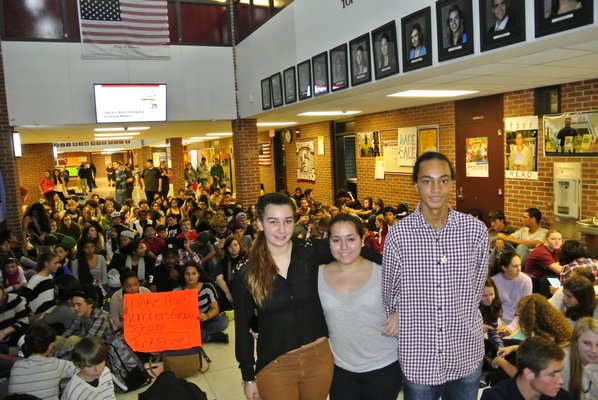 Protest organizers Emily Pepitone, Stefania Gonzalez and Sebastian Cuyjet with their classmates on Friday.  DANA SHAW