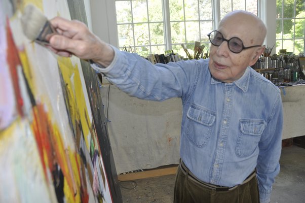 Gerson Lieber at work on a painting.  PRESS FILE