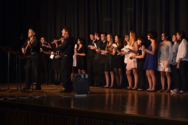 Music teacher Jim Tartaglia and Tom Nanos rally the Spanish exchange students to sing "Hey Jude" at the end of the concert. SHAYE WEAVER