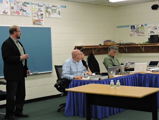 Larry Salvesen, an architect at BBS Architects & Engineers, presented a list of recommended repairs for the Remsenburg-Speonk Elementary School on Monday night. ELSIE BOSKAMP