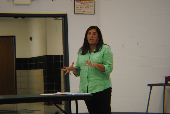 Theresa Kiernan, receiver of taxes for Southampton Town, talks about PILOT funds at the East Quogue School District board of education meeting Tuesday night. AMANDA BERNOCCO