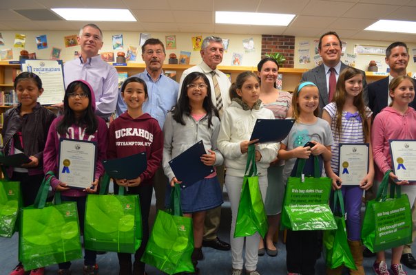Winners of the Solutions In the Bag-The Greener Southampton contest from Tuckahoe School pose with the Board of Education. BY ERIN MCKINLEY