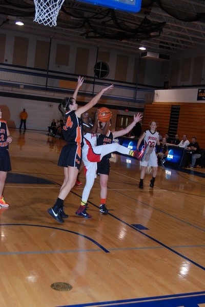 The Lady Whalers had trouble scoring in the first quarter. Nia Dawson tried to force her way through two East Rockaway players. DREW BUDD