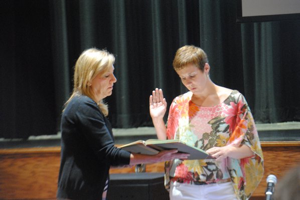 Elizabeth Scully was sworn into office by Anna Rojas, district clerk. AMANDA BERNOCCO