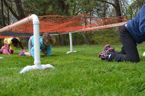 Fourth graders at Quogue School ran through an obstacle course Tuesday as part of "Turn Off the Screen Week." Alexa Gorman