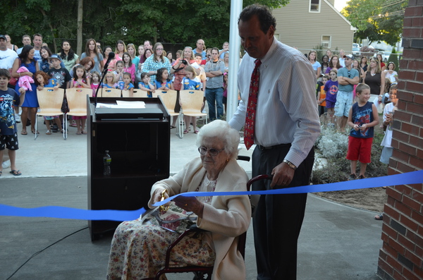 Dorothy Magnani cuts the ribbon at the South Street Elementary School last week. ERIN MCKINLEY