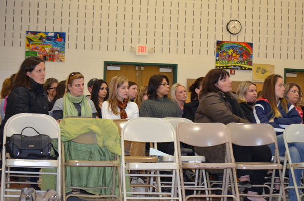 Two rows of teachers at the February 7 public hearing in support of the property purchase.