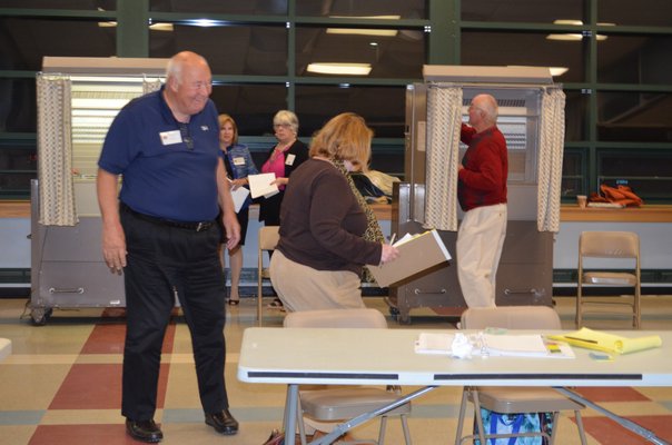Scenes from the polls on Monday night. BY ERIN MCKINLEY