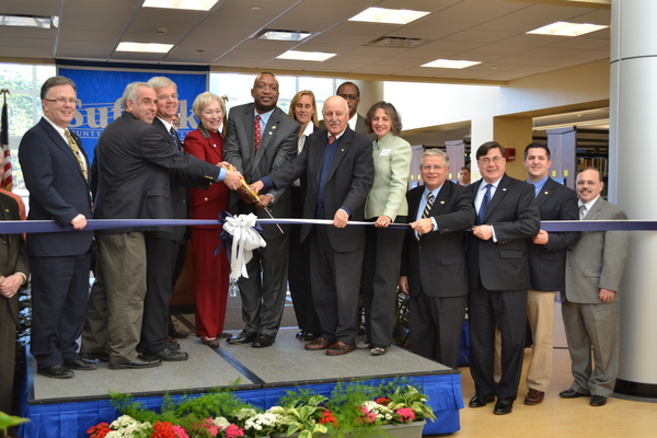 Suffolk Community College President Shaun McKay leads local elected officials in the ribbon cutting of the new Montaukett Learning Center on its Eastern Campus.