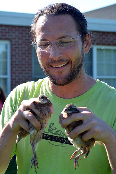 Ranger Eric Powers demonstrates the proper way to hold a Bobwhite Quail on Friday. ERIN MCKINLEY