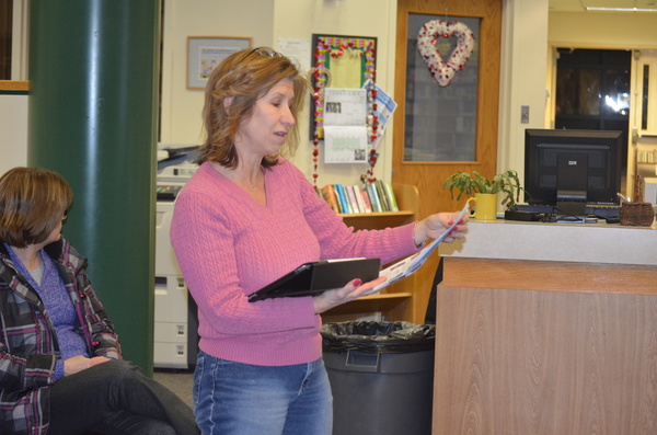 Board of Education member Suzanne Mensch is sworn in as president on Monday night. ERIN MCKINLEY