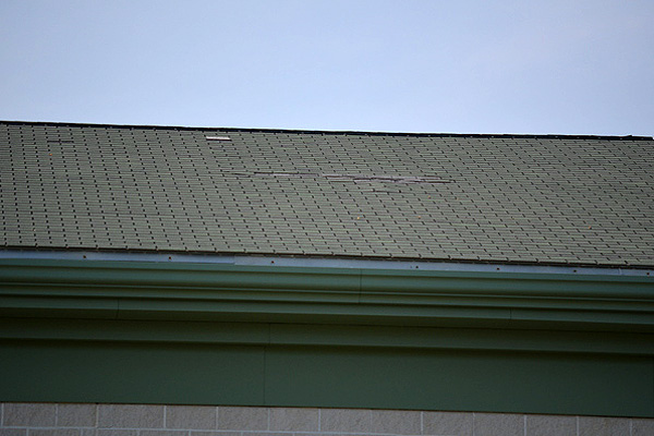 A patch of missing and loose roof shingles at the Eastport South Manor Junior-Senior High School in Manorville. ERIN MCKINLEY