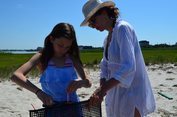 Ruby Bienen and her mom, Diana Bienen, made an oyster cage on Saturday morning. Alexa Gorman