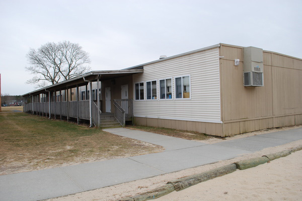 Modular classroom units behind Phillips Avenue Elementary School in Flanders.
