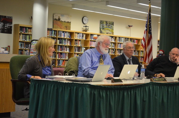 Assistant Superintendent for Business Kathleen O'Hara, left, with Board of Education members Jim Hulme, Dr. Gregory Frost, and Bryan Dean at the meeting on Monday. ERIN MCKINLEY