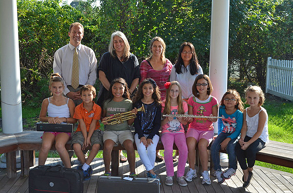 Dr. Ron Masera, top left, Michelle Quigg, April Goss, Sonya Gosnell with students Laila Goss, left, Daniel Gosnell, Janelle Aguilar, Paige Garrett, Shelby DePierro, Natalie Mae Gosnell, Mariella Aguilar, and Lauren Goss, right. ERIN MCKINLEY