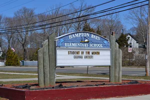 The sign outside of the Hampton Bays Elementary School on Ponquogue Avenue is the only sign in front of both the Elementary and the Middle School.