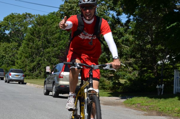 Tim Carbone rode his bike with students and faculty Monday from Quogue School to the beach. Alexa Gorman