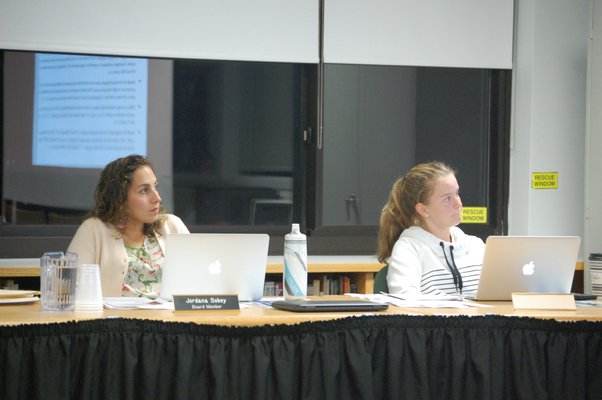 Kelly Kinsella, right, with Sag Harbor School Board member Jordana Sobey during Monday night's board meeting. JON WINKLER