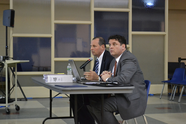 Eastport South Manor Superintendent Mark Nocero and Assistant Superintendent of Business Richard Snyder present the completed budget to the school board at it's April 13 meeting. The budget was adopted soonafter.