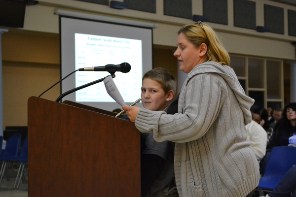 Barbara Champ and her son who is in the special education program at Dayton Avenue Elementary School address the school board at its April 13 meeting, urging district officials to preserve the program.