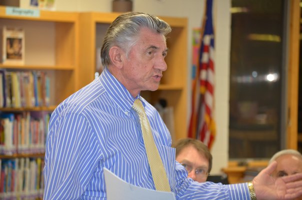 Board of Education President Bob Grisnik addresses the community at the merger study meeting held at the Tuckahoe School last week. BY ERIN MCKINLEY