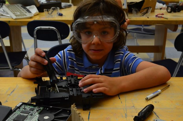 Zack Chiuchiolo, of Manorville, said he liked seeing the inside of electronics when he took them apart at Camp Invention. Alexa Gorman