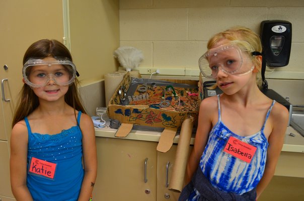 Katie Grecky, left, and Isabella Zaleski built a pinball machine at Camp Invent