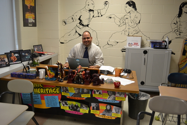 Hampton Bays history teacher PJ Lopez sits at his desk at the Hampton Bays High School. Mr. Lopez will travel to China as part of a Fulbright trip.