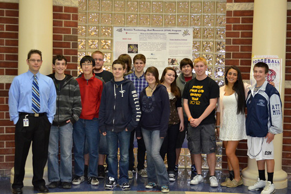 AP Biology teacher Robert Bolen with his Students Modeling A Research Topic (SMART) Team at the Eastport South Manor Junior-Senior High School.