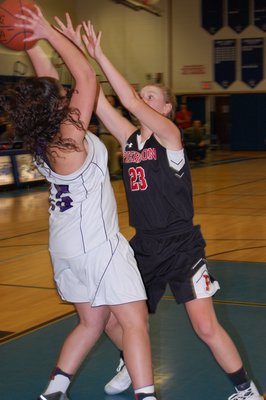 Pierson senior Isabel Peters closely defends Port Jeff's Jocelyn Lebron. ALEX FERRAIUOLO