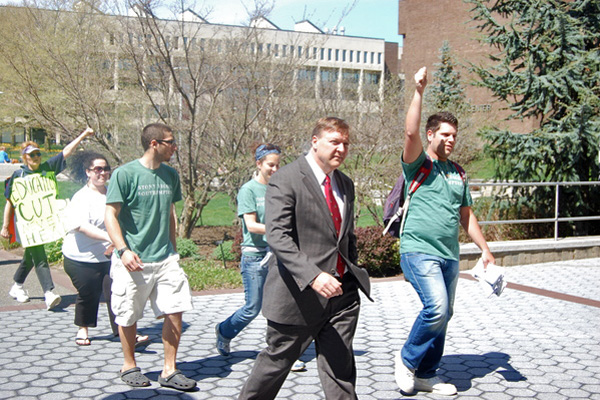 Dr. Samuel L. Stanley. Jr. heads into his office for a discussion with student-leaders. <br>Photo by Brendan O'Reilly