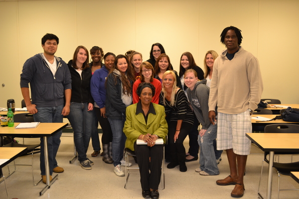 Gwendolyn Branch, center, poses with her class during its last session on May 17. The students will continue to be involved with "The Harry Project" after they leave the classroom. LAURA COOPER