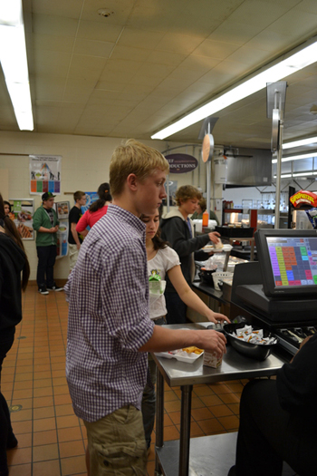 Students pick up their lunches at the Hampton Bays High School line lunch on Tuesday afternoon.