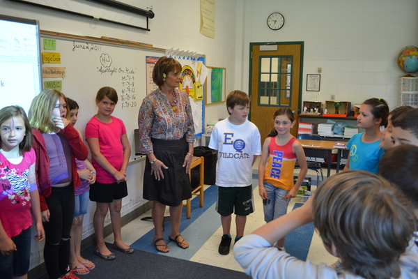 East Quogue Elementary School teacher Rosemary Enners stands alongside her third grade class during the group's 'Morning Meeting' last week.