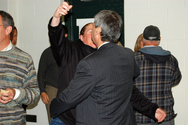 Kathy Masterson, the athletic director, embraces Lynn Schwartz, the superintendent, embrace after the results are read of the May 18 budget vote.