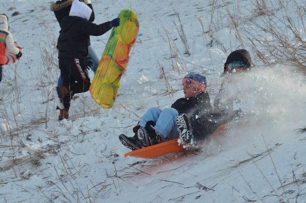 Sledding at Southampton Youth Services on Sunday afternoon.  KIM COVELL