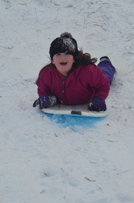 Juliette Ambrose sledding at Southampton Youth Services on Sunday afternoon.